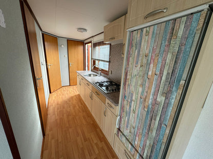 Houten chalet 10.50 x 3.80 - 2 slaapkamers - VERKOCHT